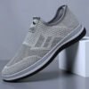Slip-on fly knit mesh sneakers for men. Hollow breathable upper, easy slip-on design without laces. Lightweight cushioned non-slip sole, great for daily walking, commute and casual wear.