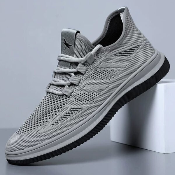 Lightweight hollow fly knit mesh upper delivers superior breathability. Elastic no-tie shoelaces for easy slip-on. Non-slip cushioned rubber outsole, ideal for daily commute, walking and casual outdoor activities.