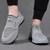 Slip-on fly knit mesh sneakers for men. Hollow breathable upper, easy slip-on design without laces. Lightweight cushioned non-slip sole, great for daily walking, commute and casual wear.